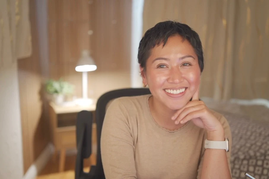 Helen Bass, LCSW, smiling with her chin on her hand