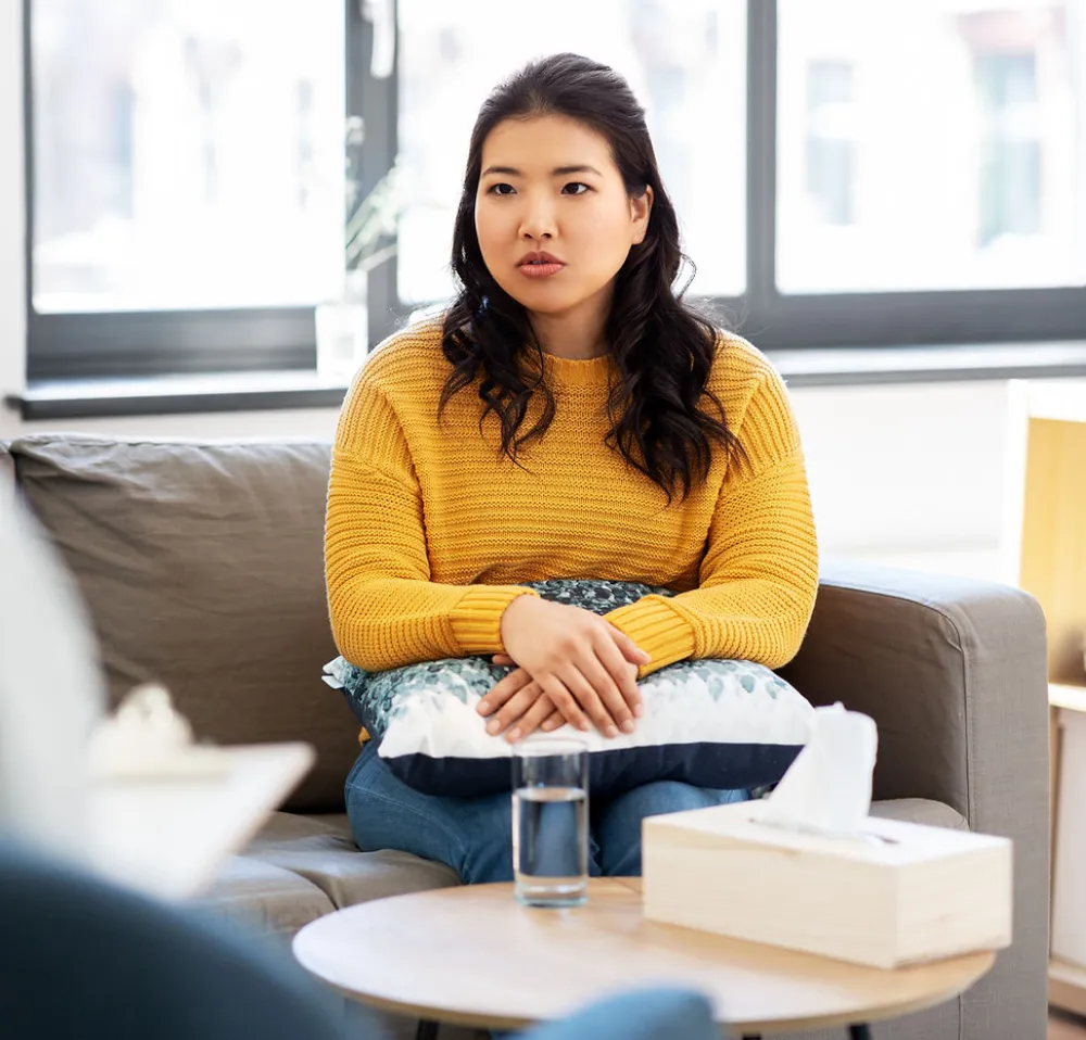 A woman in a warm therapy conversation